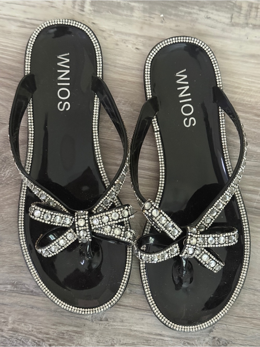 Women's Black Jeweled Bow Flip Flop Sandals